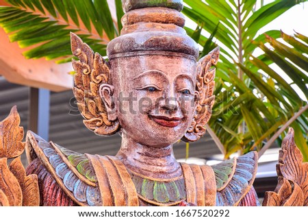 Old oriental buddhist Statue Carvings