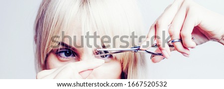 Blonde girl cut forelock. Close up hairstyle with bangs. Hair care concept Royalty-Free Stock Photo #1667520532