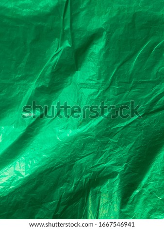 glossy green plastic as the background of a design
