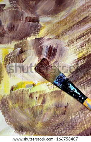Paintbrush and beautiful painting of flowers in brown and yellow colour