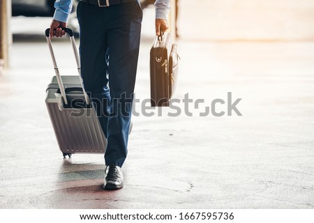 Business travelers are traveling into the country to do business while waiting for the airport trip. Royalty-Free Stock Photo #1667595736