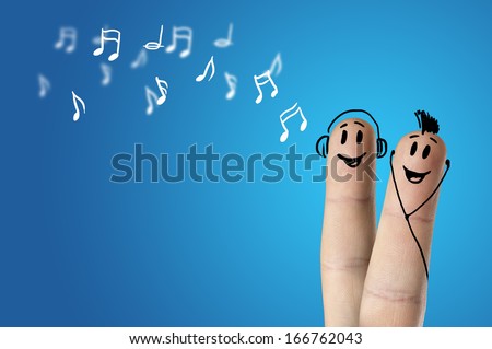 happy finger couple listening to music