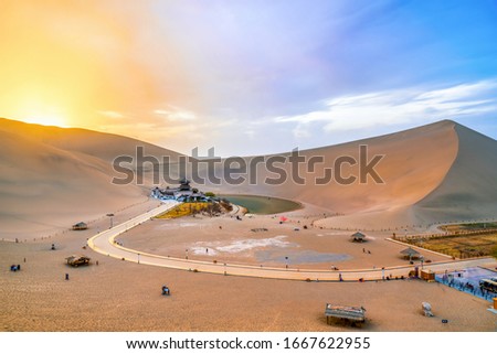 Panoramic view of the crescent spring in Mingsha mountain, Dunhuang