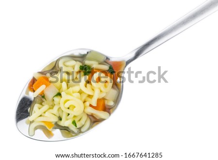 Homemade Alphabet Soup (selective focus) isolated on white background Royalty-Free Stock Photo #1667641285