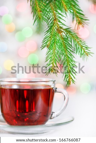 Christmas tea and fir branch  Royalty-Free Stock Photo #166766087