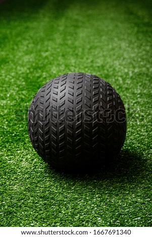 Workout exercise or fitness ball in gym on the grass.