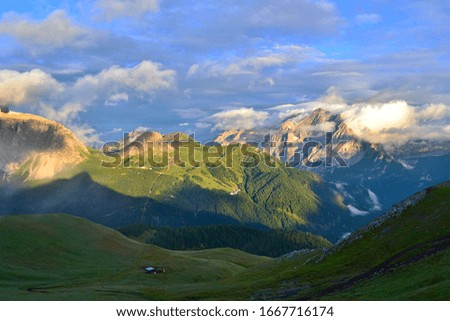 Marmolada - the highest mountain range in the Dolomites. Situated between Veneto and Trentino. Picture was taken during the sunset after heavy rain. Magical clouds.