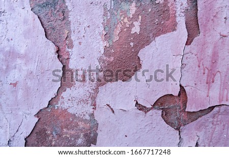 Weathering of old peeling paint. Vintage background for advertising and graffiti. Cracked paint texture. Design of a horizontal long banner with white, blue, red, purple cracked oil paint.