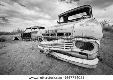 This black and white photograph of an abandoned vintage car was taken in Solitaire, which is a small settlement in the Khomas Region of central Namibia. 