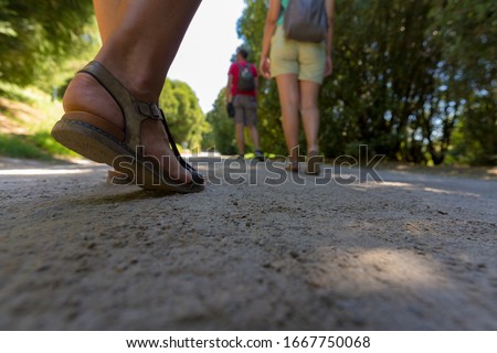 Group of friends walking through the park in Porto, Portugal Royalty-Free Stock Photo #1667750068