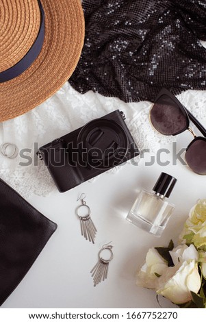 Small black camera and accessories.Travel