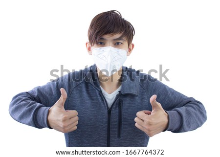 Asian man wearing mask make thumbs up sign isolate.