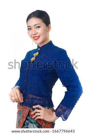 Beautiful lady in native phuket dress.