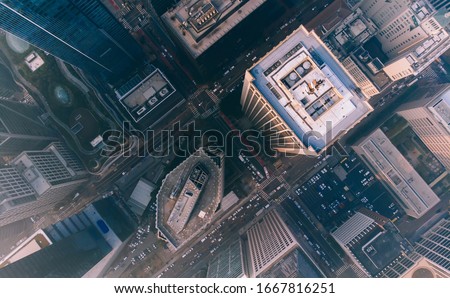 Top view of modern cityscape of rooftops and buildings in business and finance center of city,from above picture of skyscrapers with rental real estate and residential apartments in megalopolis