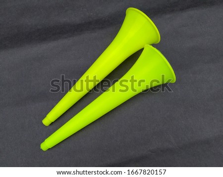 blank vuvuzela stadium plastic horn. fan vuvuzela trumpet isolated on black  background