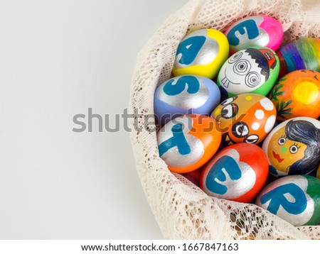 Easter eggs, colorful painted handmade in many cute styles and placed on lace fabric