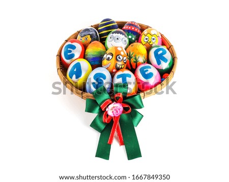 Easter eggs, colorful painted handmade in many cute styles and placed in bamboo basket and bow tie gifts on white background