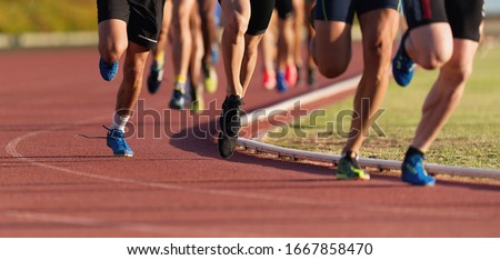 Athletics people running on the track field Royalty-Free Stock Photo #1667858470
