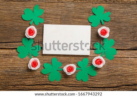Happy Saint Patrick's Day , shamrock clover leaves with copy space  on wooden Background