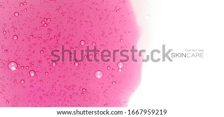 Skin care cosmetic background concept with a layer of pink facial mask in gel texture. Macro image isolated on white background with copy space