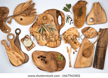handmade olive wooden dishes on white background