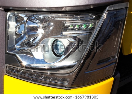 Modern truck headlight with diode illumination. Road safety concept, close-up. LED