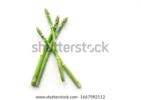 Isolated fresh asparagus spear. Top view.  Royalty-Free Stock Photo #1667982112