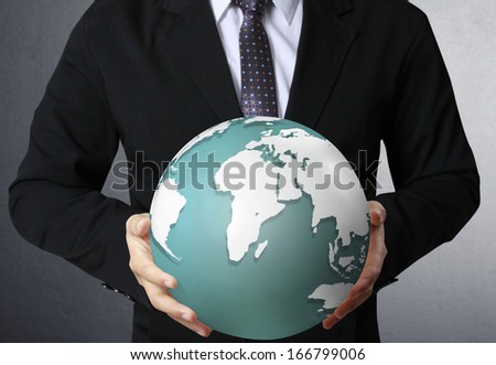 holding a glowing earth globe in his hands ,earth texture by NASA