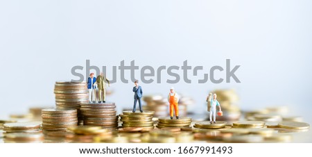 Miniature people standing on stack of coins. Inequality and social class. Income and economic inequality concept. Inequality in social class, ideology, Gender, Racial and ethnic and health. Royalty-Free Stock Photo #1667991493