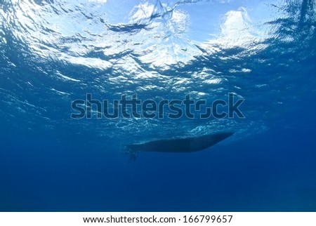 Boat silhouette under water, Hawaii.