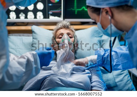Infected patient in quarantine lying in bed in hospital, coronavirus concept. Royalty-Free Stock Photo #1668007552