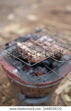 grilling basket on charcoal grill after use for a while, rusty and contamination on metal from food burnt and carbon