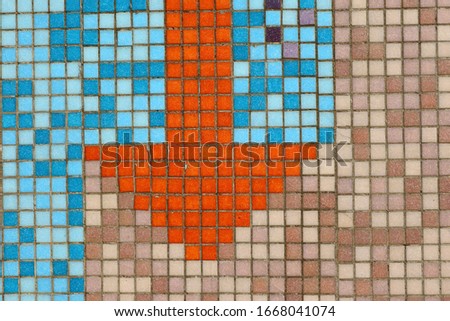 arrow sign mosaic tiles on the wall