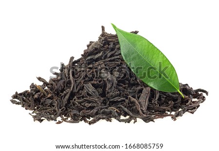 Dry black tea and fresh tea leaf isolated on a white background. Black Ceylon tea. Royalty-Free Stock Photo #1668085759