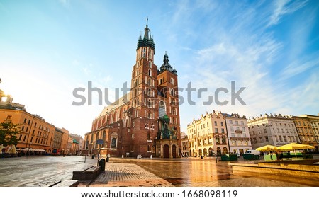 St. Mary's Basilica on the Krakow Main Square (Rynek Glowny) during the sunrise, Poland Royalty-Free Stock Photo #1668098119