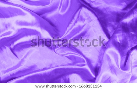violet satin has a wavy appearance very colorful and clean. Silk abstract background