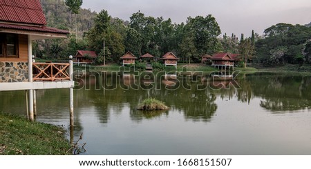 Houses on the shore of a tropical lake