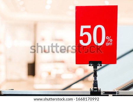 Holiday Sale Banner sign in department store, 50% OFF Special Offer Ad. Discount Promotion Banner.Price Discount Offer. Season Sale Promo Sticker colorful background.50 percent Mega Discount sale.