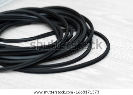 The hank of black rubber seal gasket for pvc windows. Royalty-Free Stock Photo #1668171373