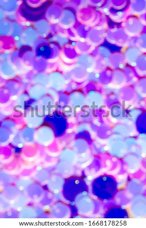 Stock Photo - 
purple holographic sequins background