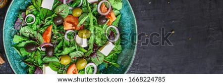 healthy salad
olives, lettuce, tomato and cheese
feta (greek salad, tasty vegetables snack) menu concept background. top view. copy space for text