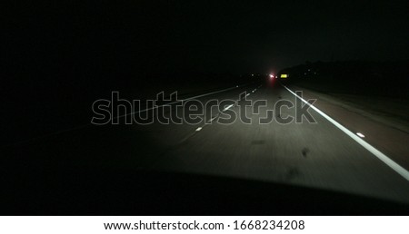 Passenger perspective driving on highway road at night