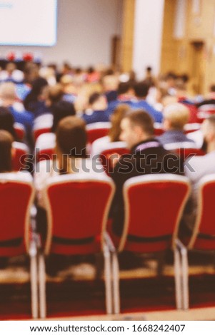 Conference blurred image. Group of business people listening at a conference. Defocused image. People in the auditorium. International Conference. Blurred image. vintage photo processing