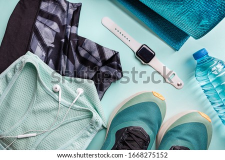 Healthy lifestyle, sport or athlete's equipment set on bright background. Flat lay. Top view with copy space. Royalty-Free Stock Photo #1668275152