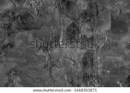 Destroyed chipped wall of cellar farm house. Dirty exterior urban facade. Black white ruined structure background. Grunge uneven old stone rock texture. Outside crack crash cement mortar for 3d design
