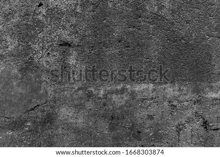 Shattered plaster on cement gypsum painted dry wall. Flaked exterior city facade. Coarse grunge, black white background. Uneven  surface of loft stone structure. Decorative sandstone texture 3d design