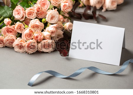 Roses and postcard for woman for special occasion