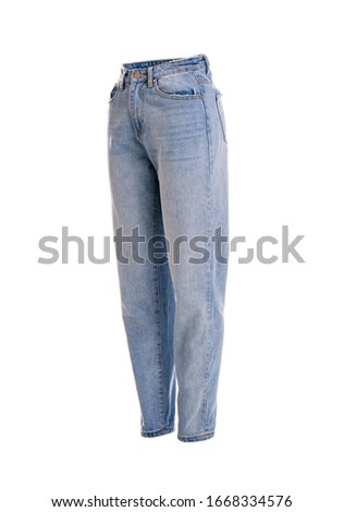 Stylish jeans on mannequin against white background. Women's clothes