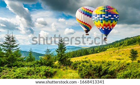 Amazing view of mountains with colorful hot air balloons. Travel concept. Artistic picture. Beauty world.