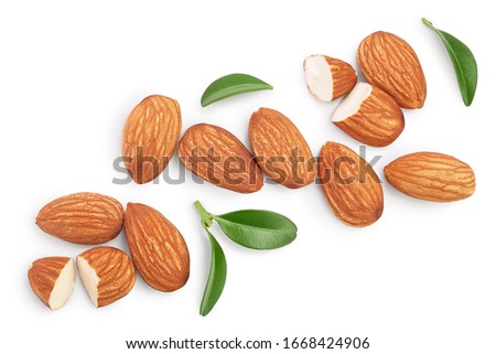 Almonds nuts with leaves isolated on white background with clipping path and full depth of field. Top view. Flat lay